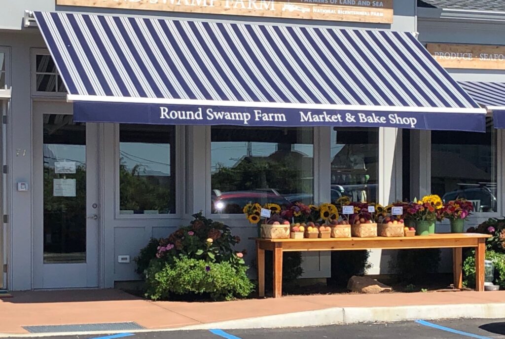 Blue and white fixed commercial awning for Round Sweep Farm Market and Bake Shop.
